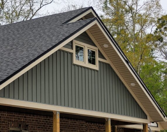 A house with a roof that has been painted gray.