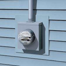 Here's a short alt tag for the image: Electric meter installed on house siding.